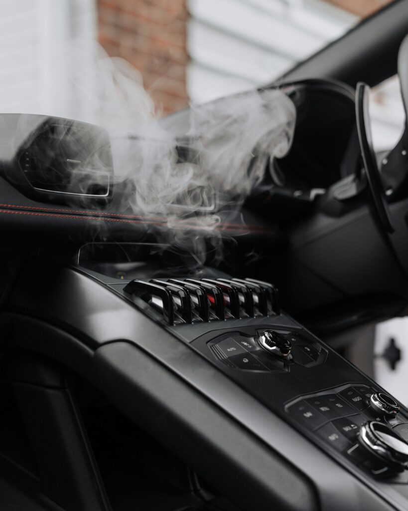 Why Does It Smell Like Gas in My Car? guide to fuel leaks, emissions issues, gas caps, engine problems, fire risks, warning signs, and safety steps.